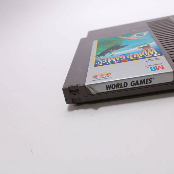 Nintendo NES - World Games - Cleaned, Tested & Working - some battle damage